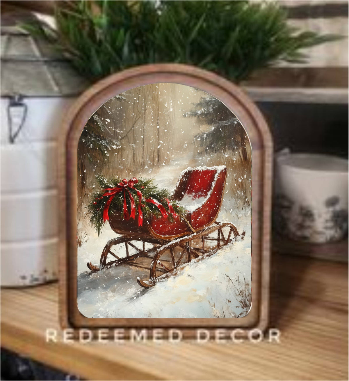 Arched wood-framed canvas print of red vintage sleigh in snowy winter forest scene