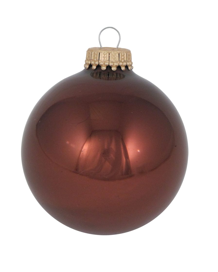 Shiny deep brown round glass Christmas ornament with gold decorative cap and silver wire loop