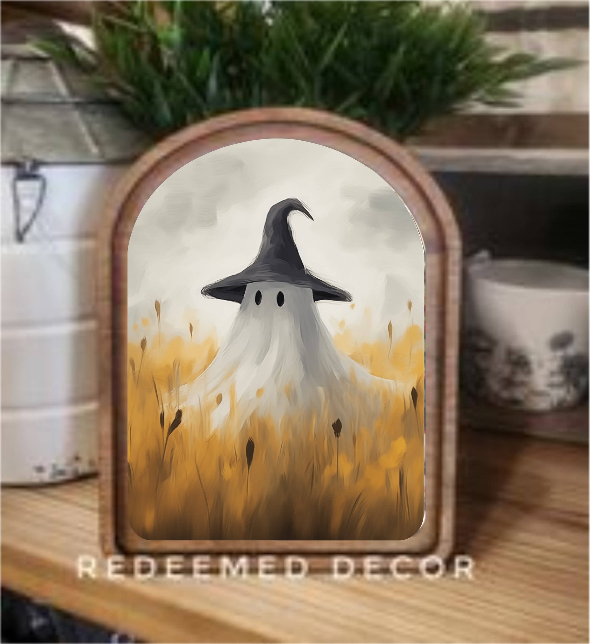 Framed canvas art of a ghost in witch hat standing in golden wheat field