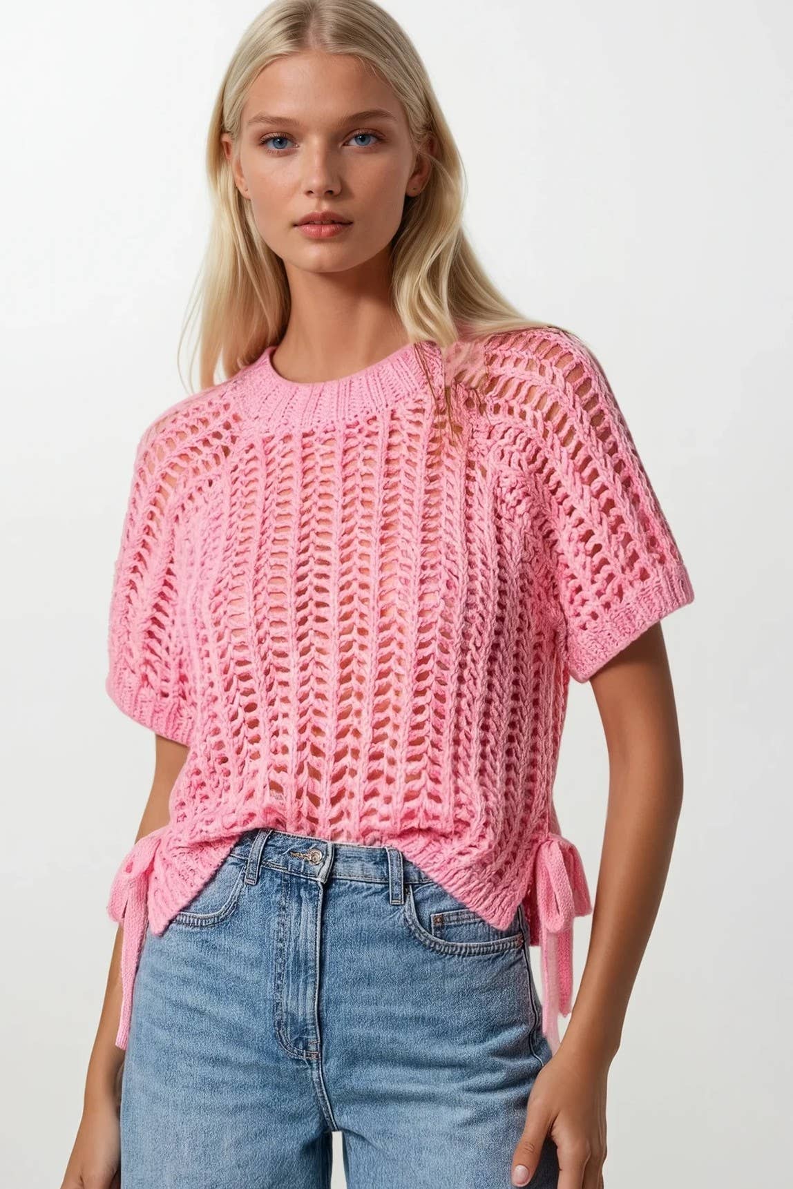 Pink chunky open-knit crochet sweater top with short sleeves and side tie details