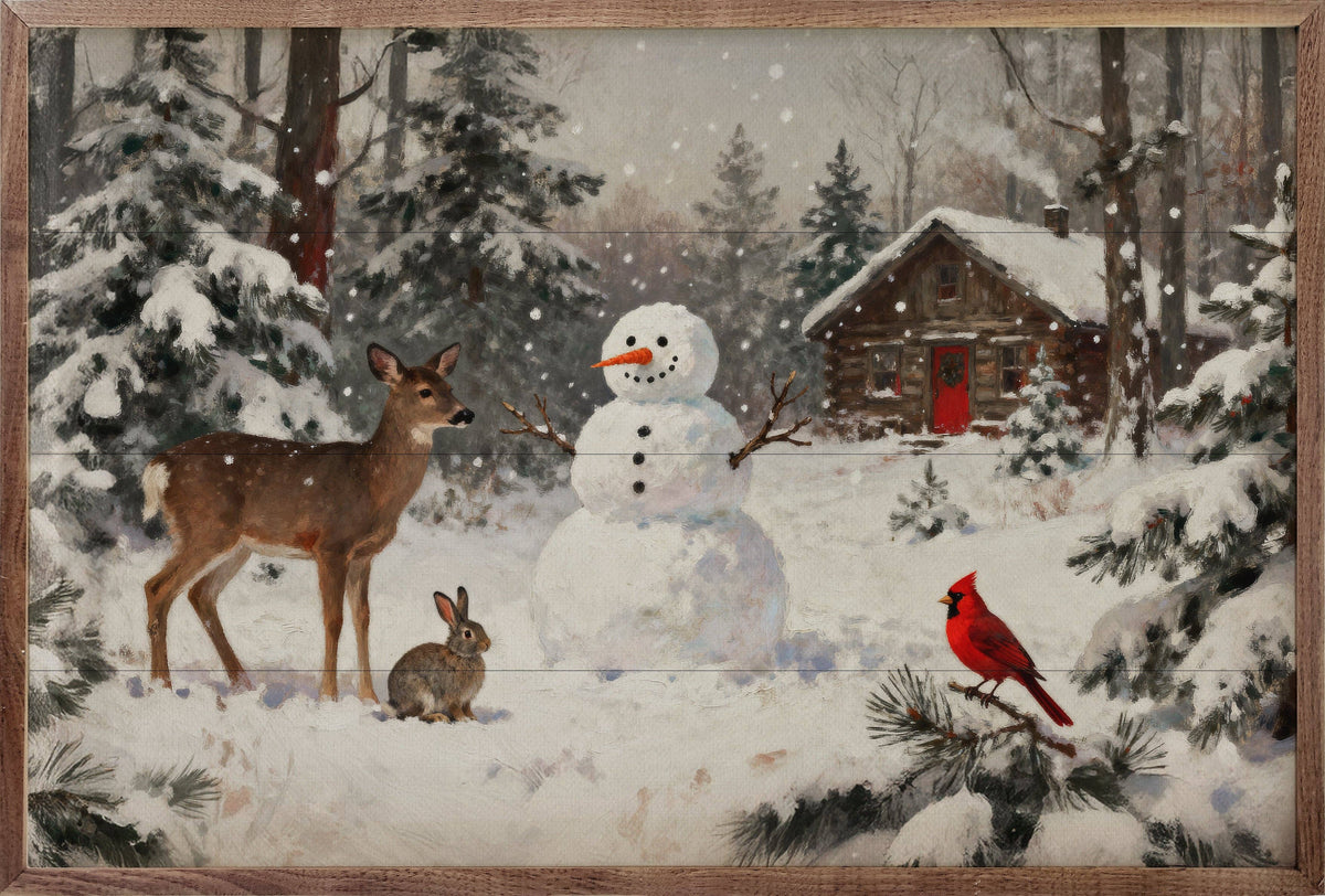 Framed winter woodland wall art with deer, rabbit, cardinal, snowman, and log cabin