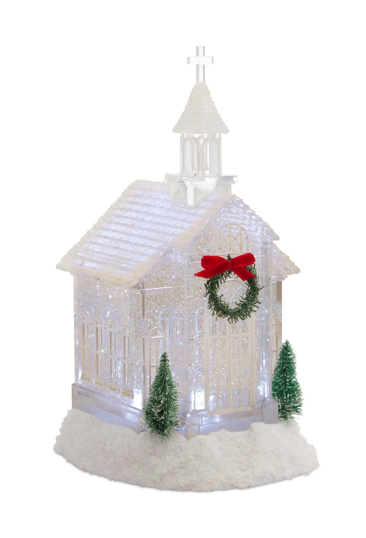 Illuminated glittery church figurine with steeple, cross, wreath, and miniature trees on snowy base