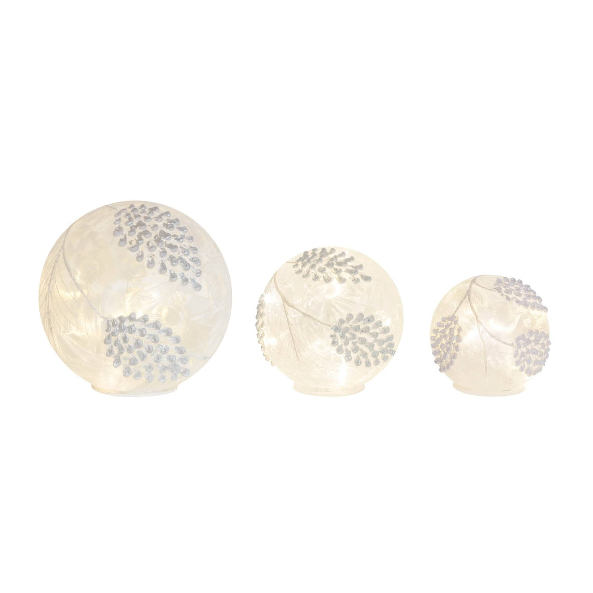 Set of three illuminated frosted glass globe orbs with embossed pine cone and leaf designs, graduating sizes