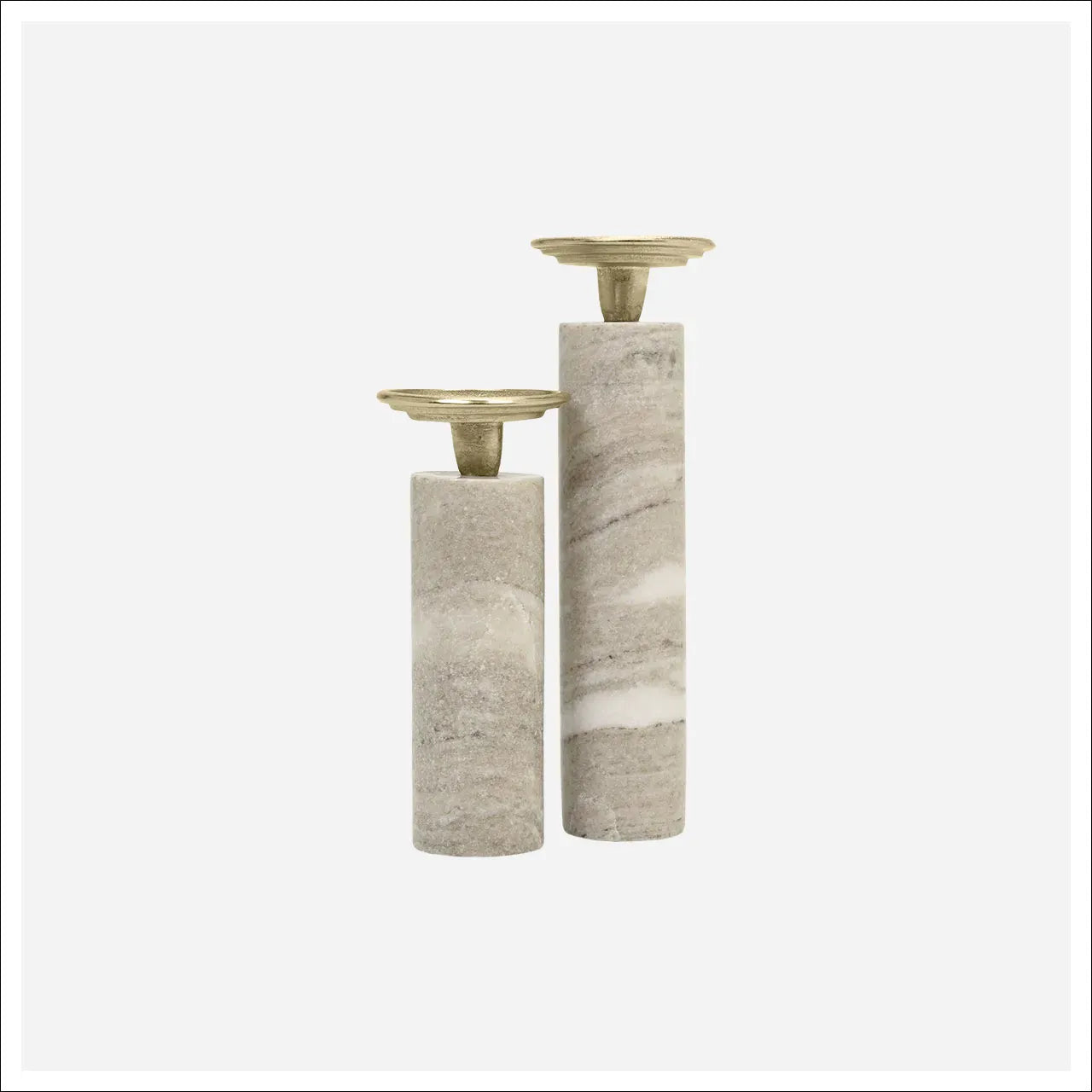Two cylindrical gray marble candleholders with gold brass tops in two heights