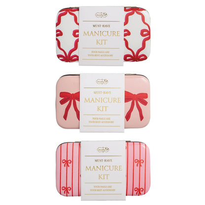 Mud Pie manicure kits in three bow-print tin cases: white, blush pink, and pink stripe