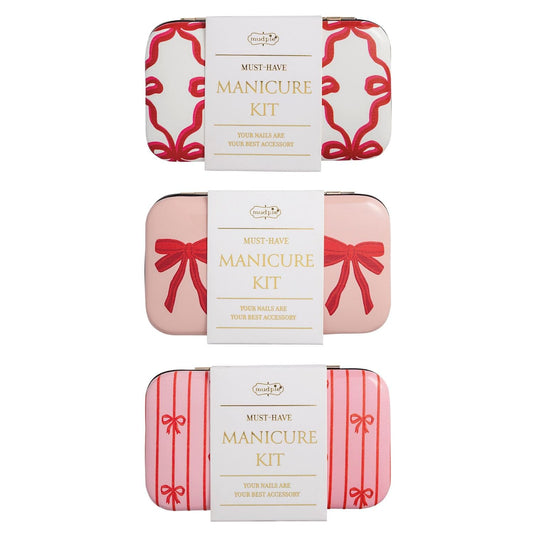 Mud Pie manicure kits in three bow-print tin cases: white, blush pink, and pink stripe