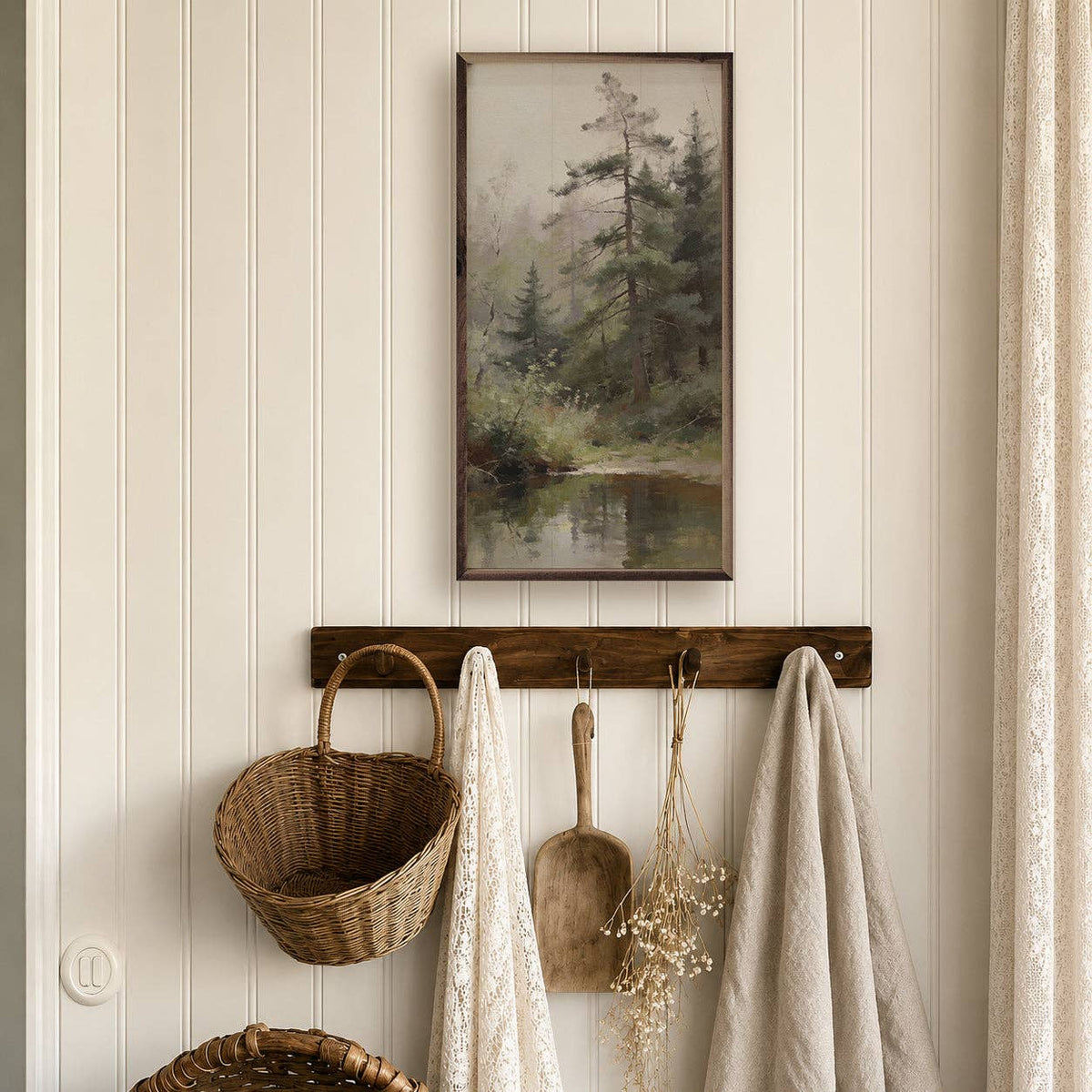 Framed pine forest oil painting print hung above rustic wood wall hook rack