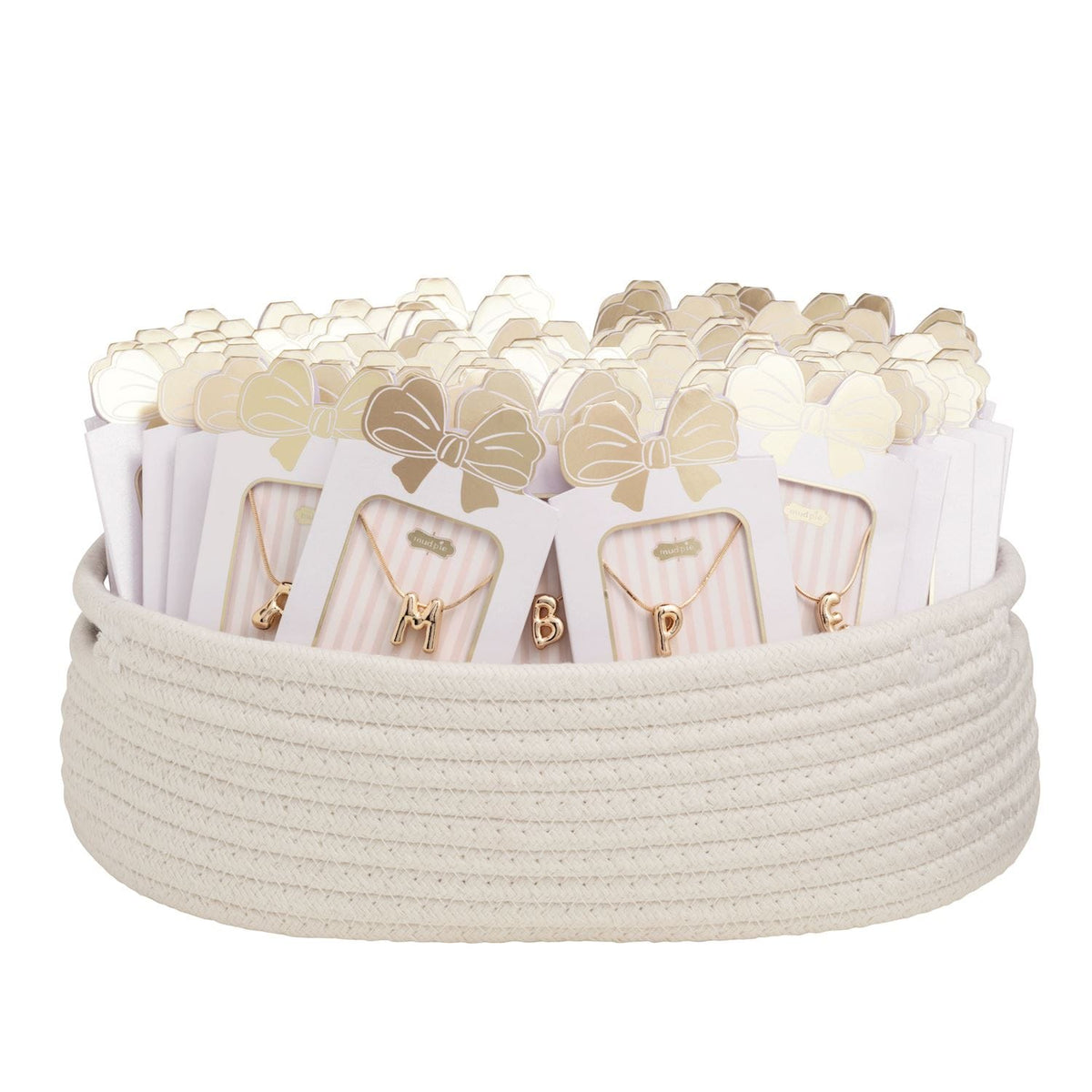 Gold balloon initial letter necklaces on pink striped cards displayed in a white rope basket
