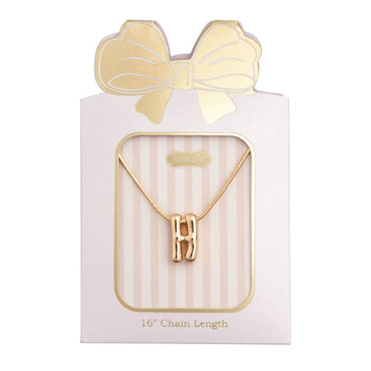 Mudpie gold bubble letter H initial necklace on pink striped gift card packaging