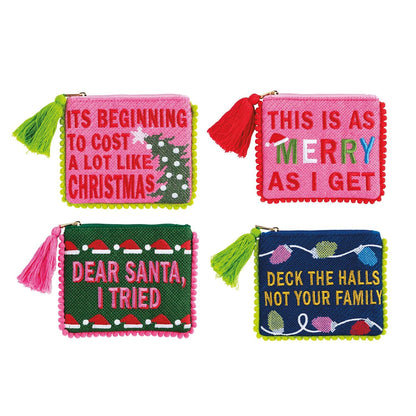 Four pink, green, and navy embroidered zip pouches with pom trim and holiday sayings