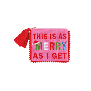 Pink holiday coin pouch with pom trim, red tassel, and festive Christmas text