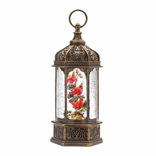 Hexagonal lantern-style snow globe with red cardinal birds on snowy branches, bronze finish