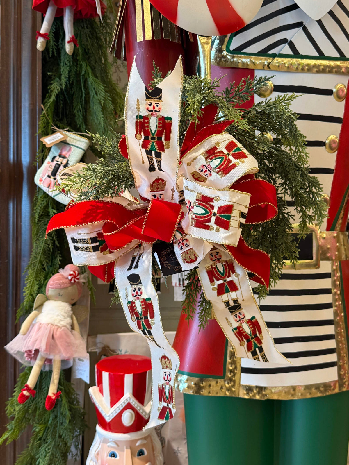 Nutcracker Bow by Cheris Customs, white ribbon with red soldier print and red velvet center bow