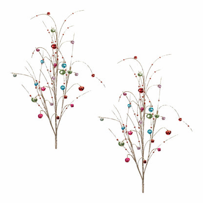 Two glittery branch sprays adorned with colorful jingle bells and small red beads, front view