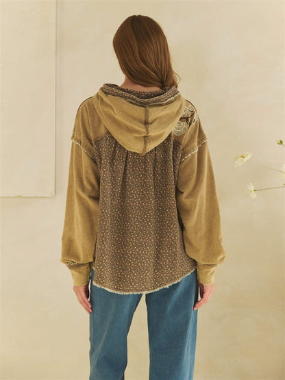 Olive washed hoodie with floral back panel, lace detail, and raw hem edges