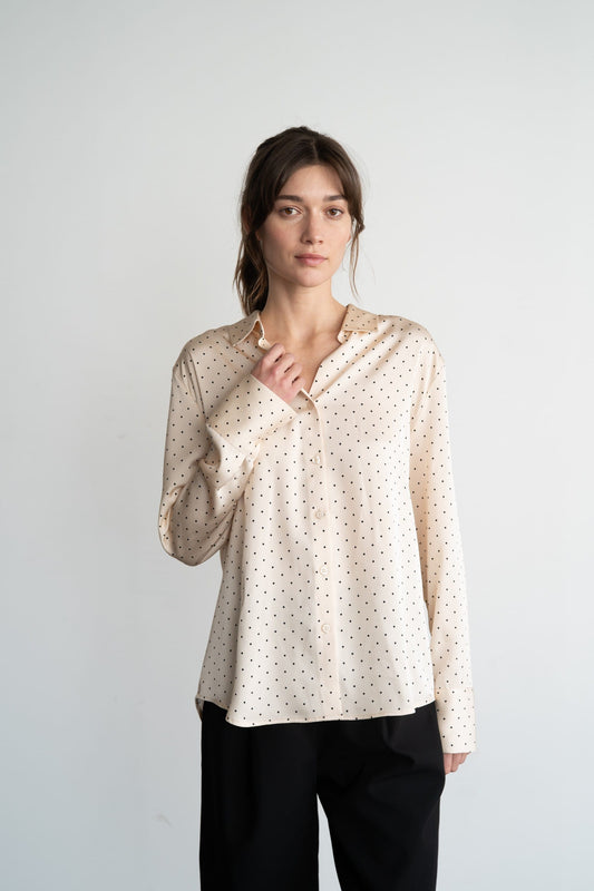 Cream satin button-up blouse with black polka dots and long sleeves