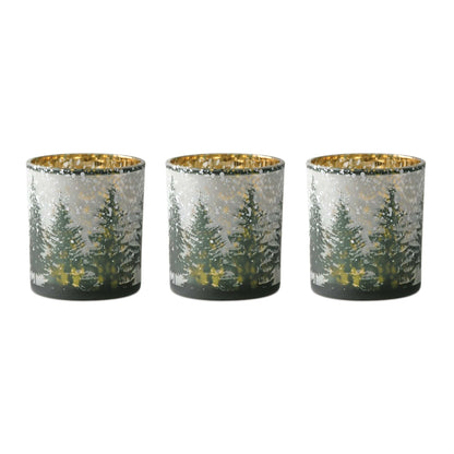 Set of three glass votive holders with snowy pine tree forest design and gold metallic interior