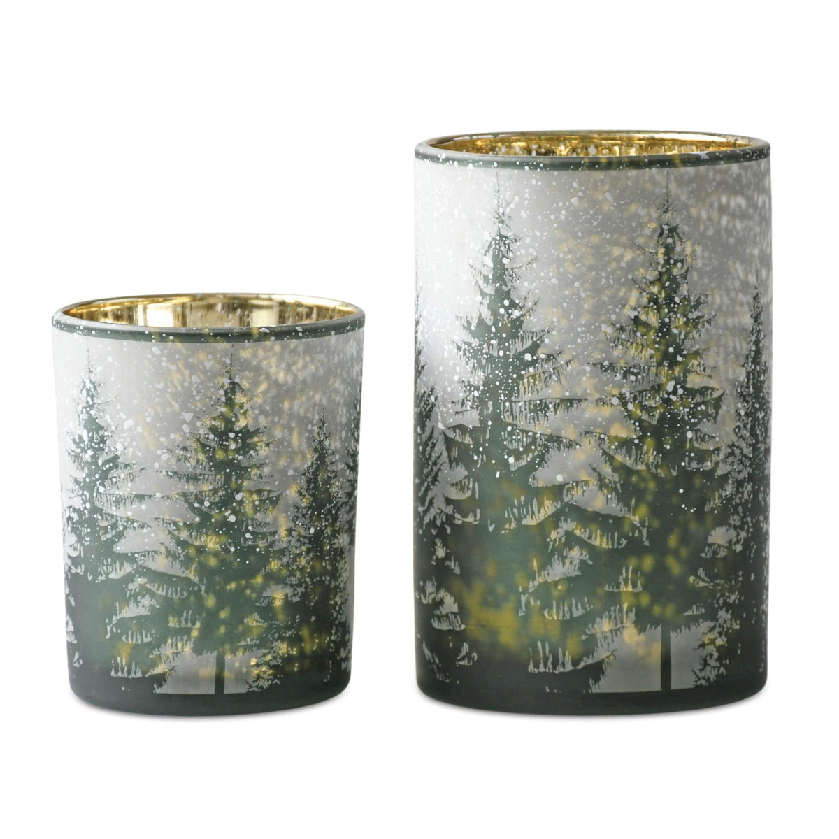 Two green glass candle holders with snowy winter forest tree pattern in two sizes