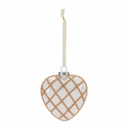 Heart-shaped glass ornament with gold beaded diamond lattice pattern and cream ribbon hanger