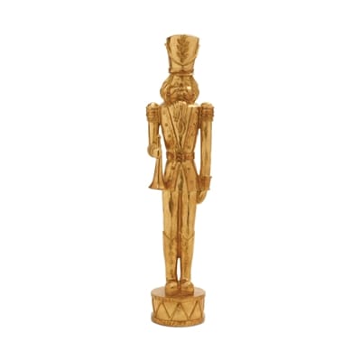 Gold nutcracker soldier statue holding trumpet, standing on decorative drum base