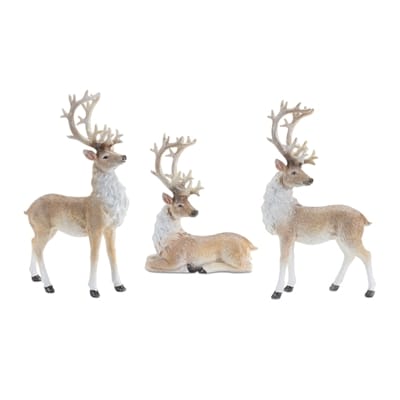 Set of three resin deer figurines with antlers and white fur accents in tan and brown