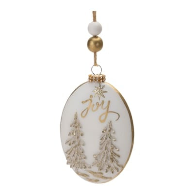 White and gold oval glass ornament with Joy script and glitter Christmas trees