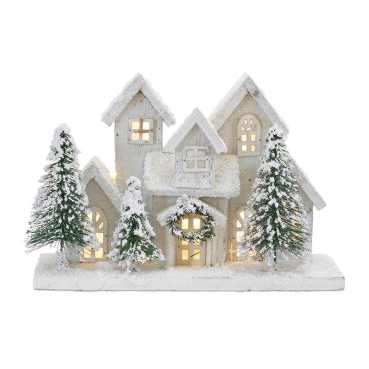 Lighted wooden winter village scene with snow-dusted houses and evergreen trees on white base
