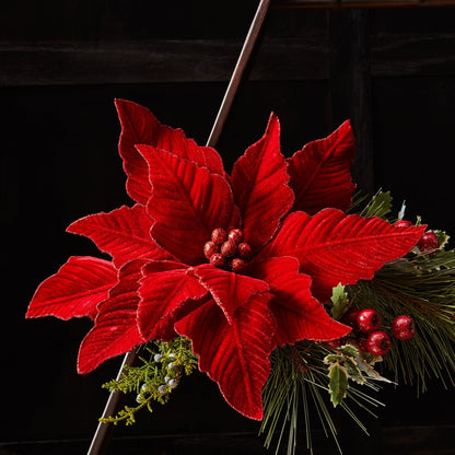 Large red velvet poinsettia stem with glitter accents, holly berries, and pine branches