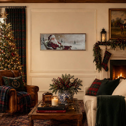 Framed Santa sleigh ride canvas art displayed in a cozy Christmas living room