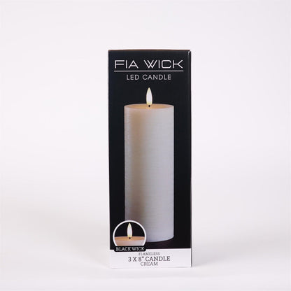 Flameless LED pillar candle in cream, 3x8 inch, shown in black retail packaging box