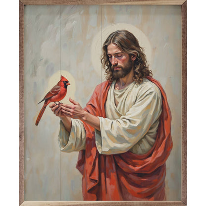 Framed oil painting of Jesus holding a red cardinal bird in cupped hands