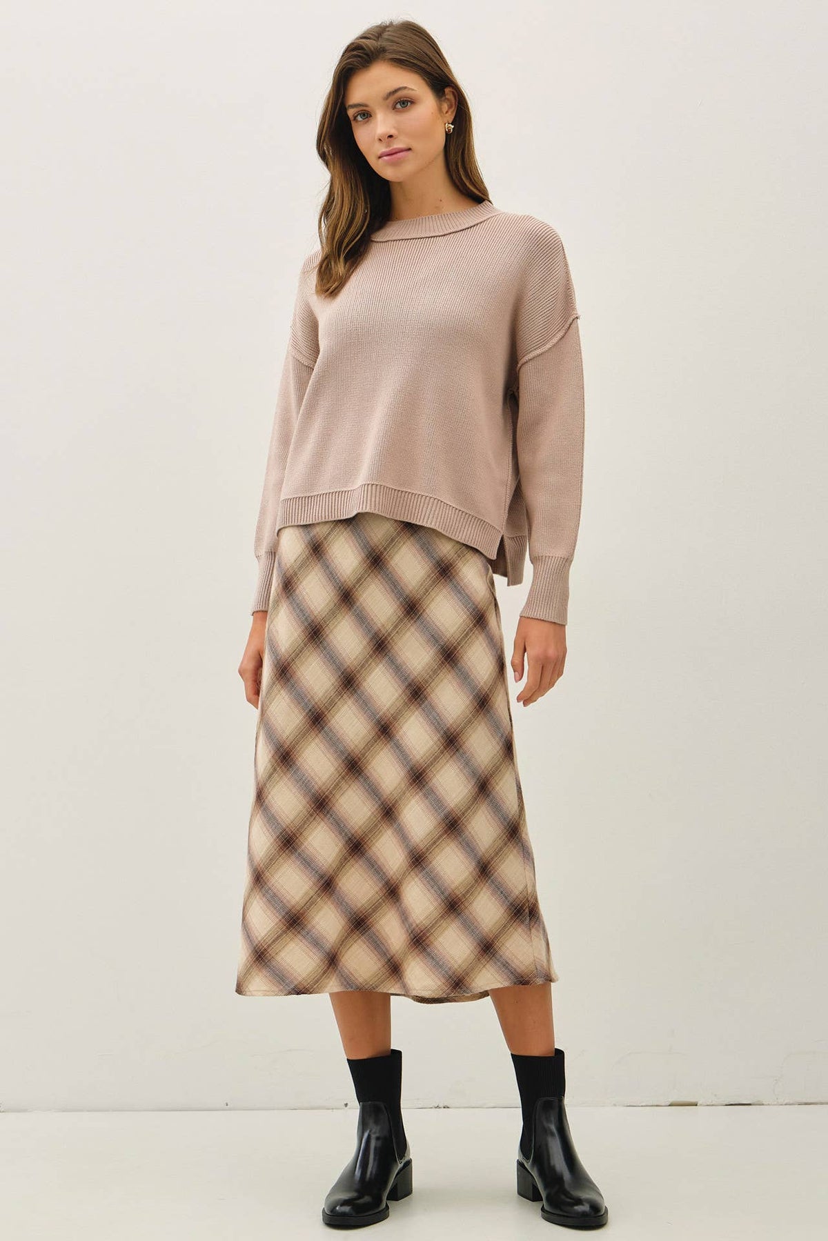 Relaxed oversized blush pink ribbed knit sweater with long sleeves and boat neckline