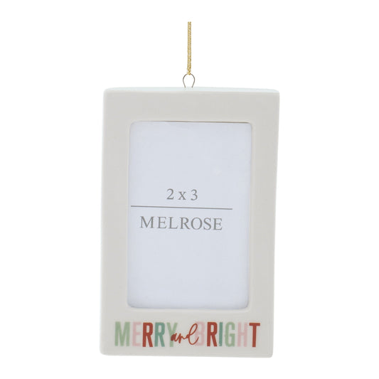 White rectangular photo frame ornament with gold hanging cord and 'Merry and Bright' text, front view