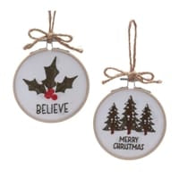 Two round Christmas ornaments with burlap bows, holly Believe and Merry Christmas tree designs