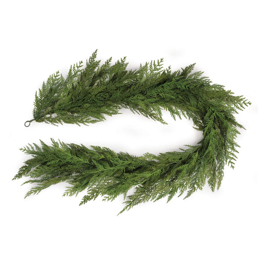 Artificial cedar garland with realistic flat-fan foliage, coiled in oval shape, top view