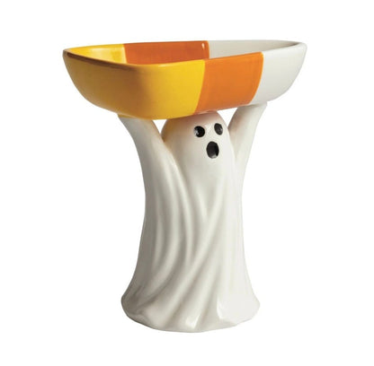 Ceramic ghost figurine holding an orange and yellow striped candy bowl overhead, front view