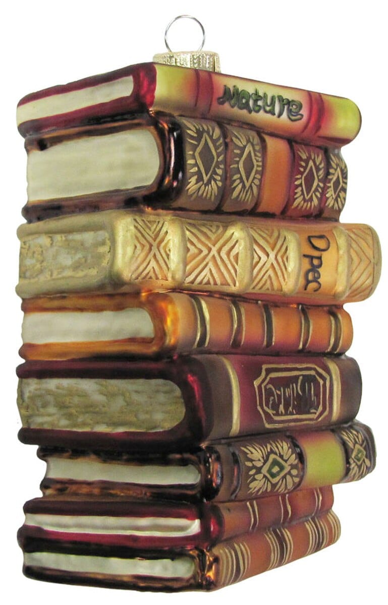 Glass ornament shaped like a stacked pile of antique books in rich amber and burgundy tones