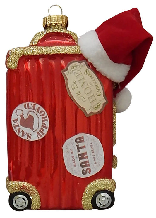 Red glitter-trimmed glass suitcase ornament with Santa hat and travel stickers