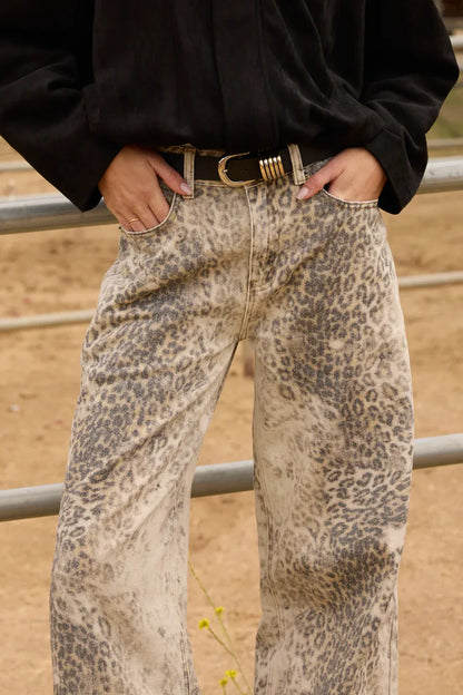 Vintage Havana leopard print washed wide leg jeans with black leather belt