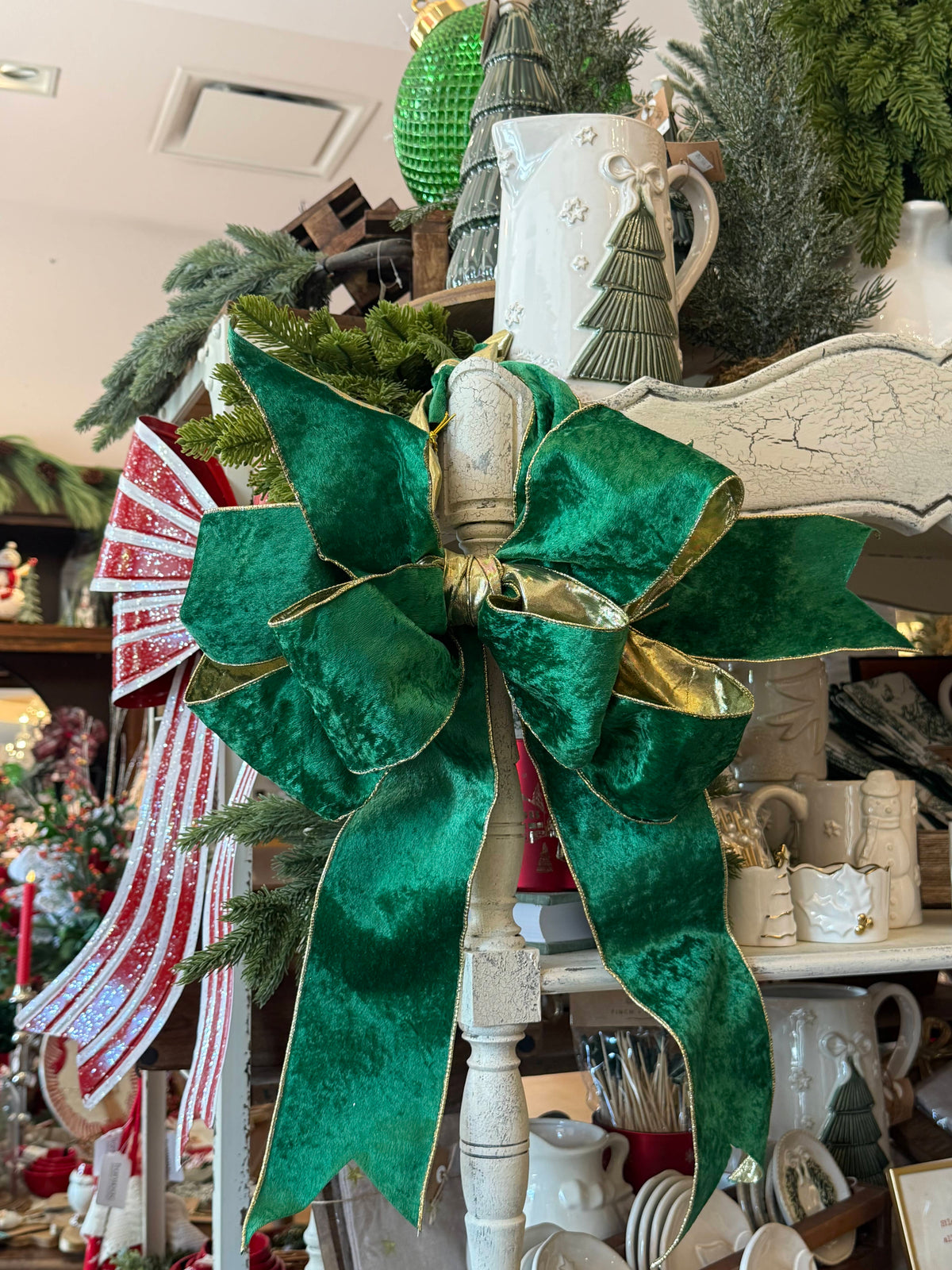 Large emerald green velvet bow with gold trim edges, holiday Christmas décor