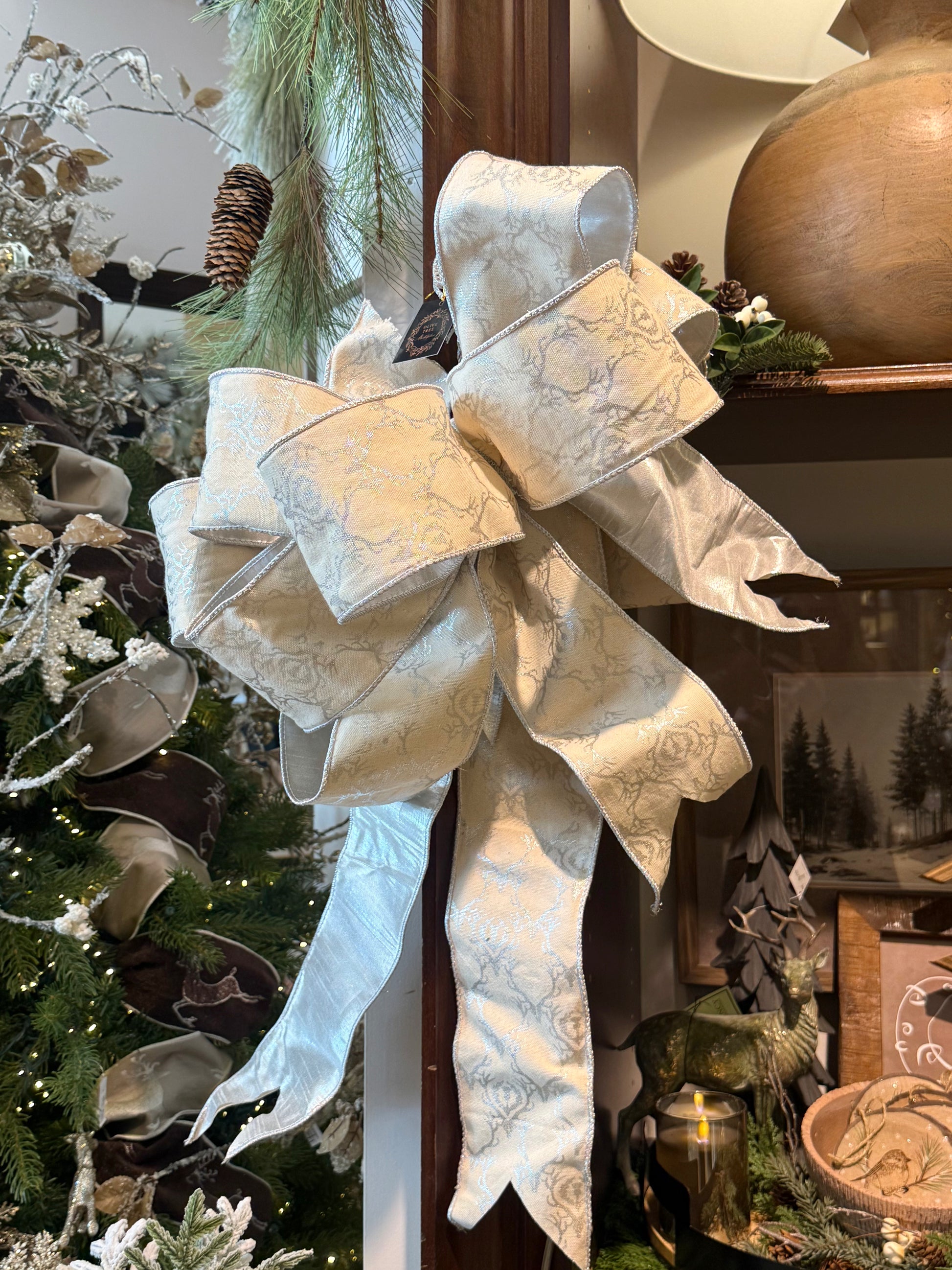 XL cream damask wired ribbon bow with silver deer antler pattern and long tails