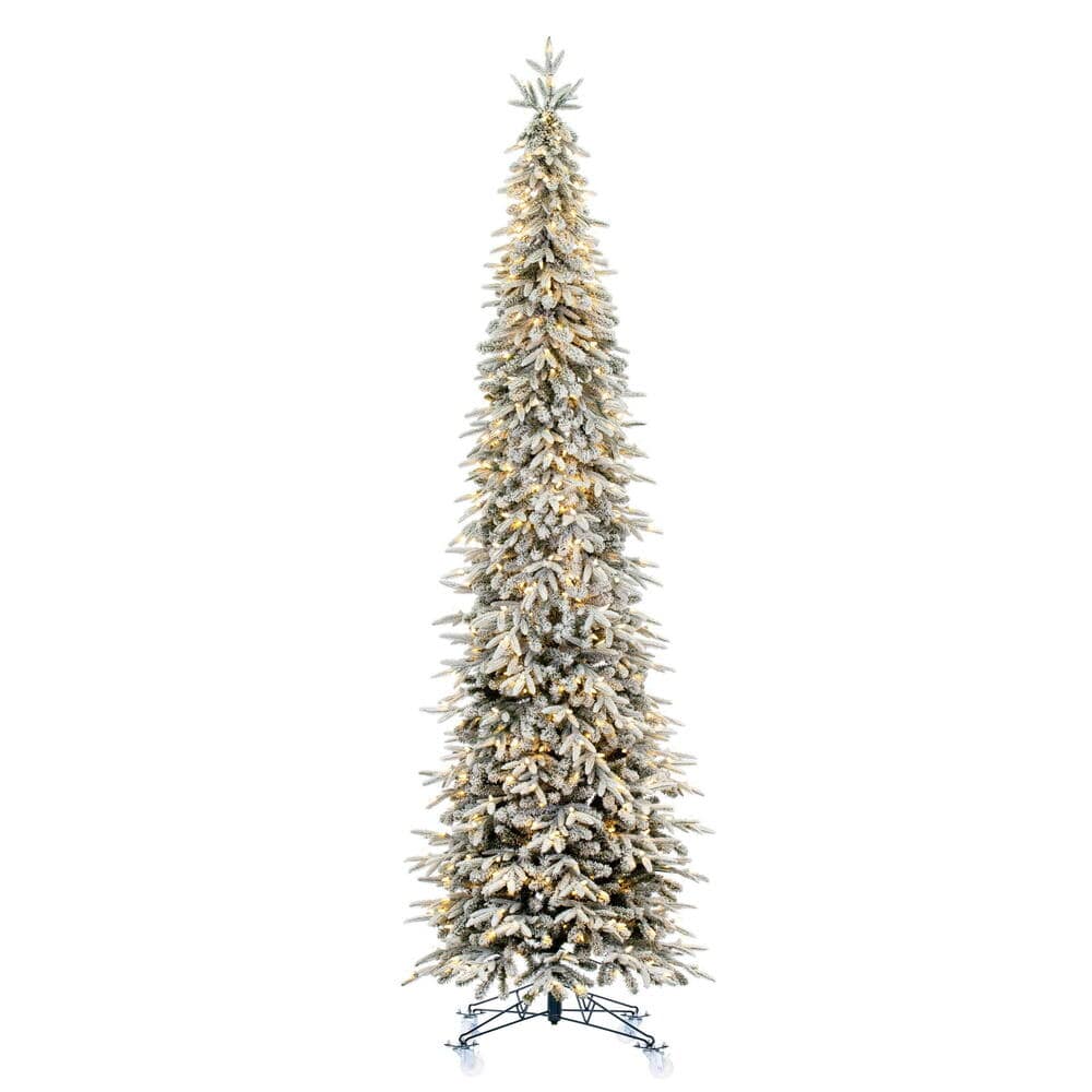 Slim flocked artificial Christmas tree with warm white LED lights and metal stand