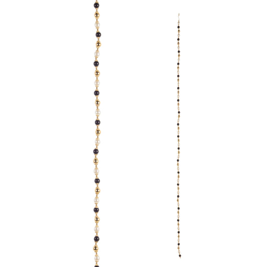 Long beaded garland with alternating black, pearl white, and gold beads, shown full length