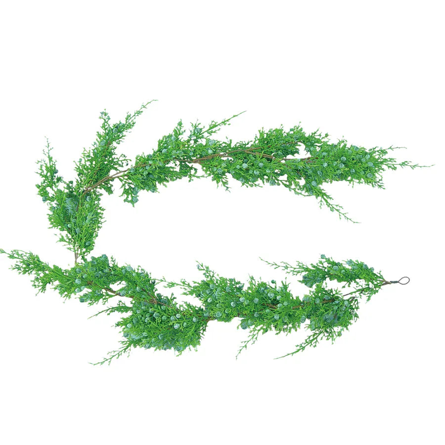 Artificial juniper pine garland with blue-green berries on white background