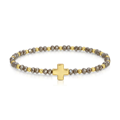 Gold cross beaded stretch bracelet with faceted gray crystal and gold accent beads