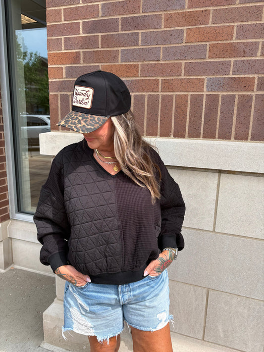 Black quilted and waffle fabric mixed v-neck pullover top by Olive Tree