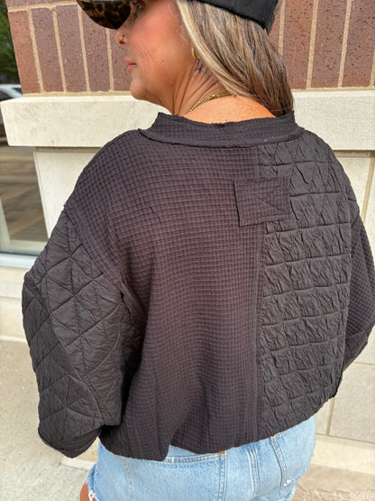 Black mixed quilted and waffle fabric cropped top, back view