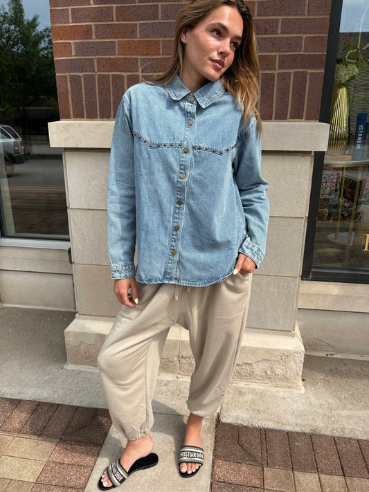 Light wash denim shirt with stud detail chest pockets and snap buttons