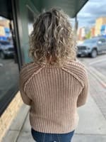 Back view of taupe ribbed cable knit sweater with textured shoulder detail