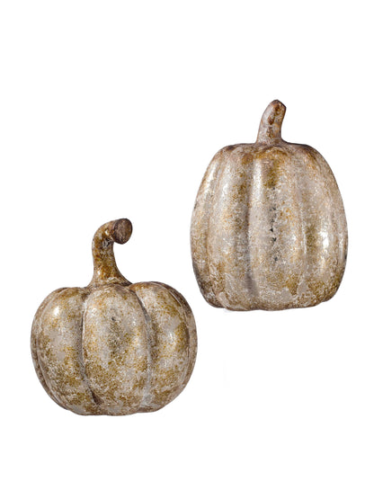 Two decorative resin pumpkins with aged, weathered gold and white finish, different sizes, studio view